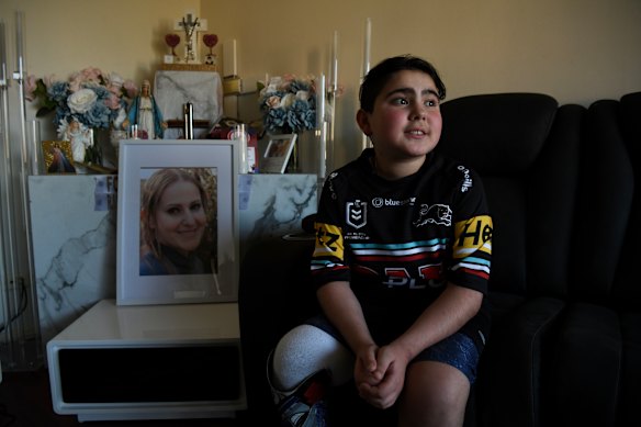 Nicholas Tadros sits by a portrait of his late mother, Vanessa, at the family’s Glenmore Park home.