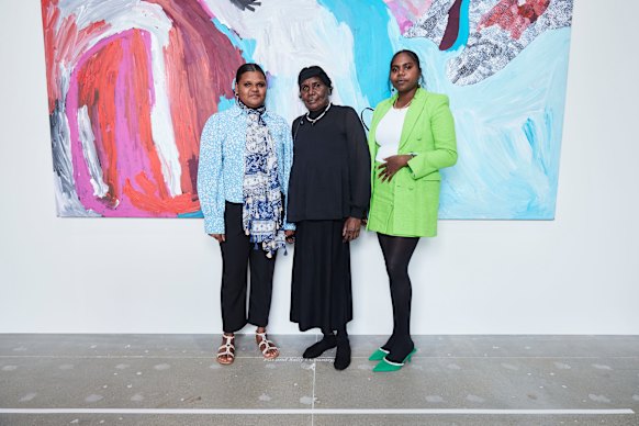 From left, Sally Gabori’s great-granddaughter Tori Juwarnda Wilson-Gabori, daughter Amanda Gabori Dibirdibi and great-granddaughter Narelle Gabori in Paris in 2022.