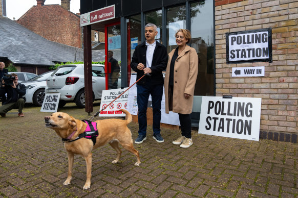London Mayor Sadiq Khan and his woman  Saadiya get  with their canine  Luna to formed  their votes successful  the London mayoral predetermination  connected  Thursday.