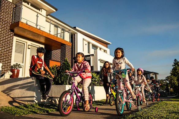 Austral locals out the front of their  homes. Children here play on footpaths due to a lack of parks.