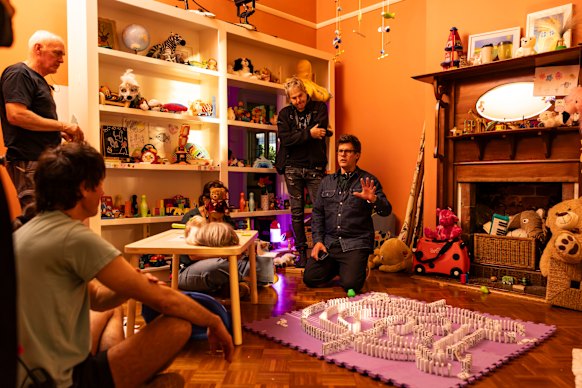 On the set of Knee High Spies, in which puppeteers inside animatronic suits filmed in front of a green screen.