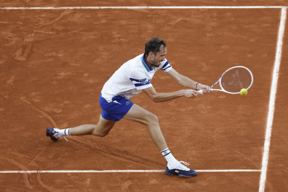 Daniil Medvedev plays a shot against Tomas Machac at Roland-Garros.