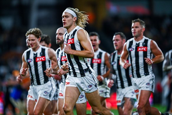 Darcy Moore leading the Magpies.
