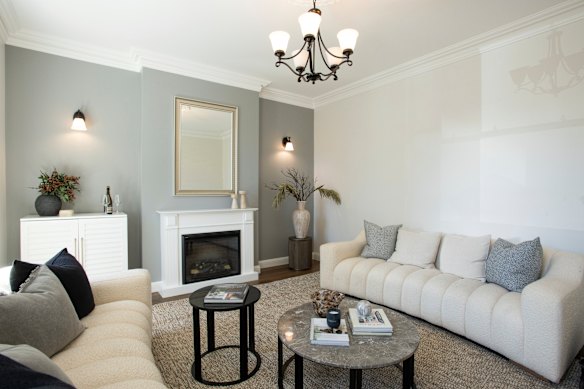 One of those front rooms has an elegant fireplace.