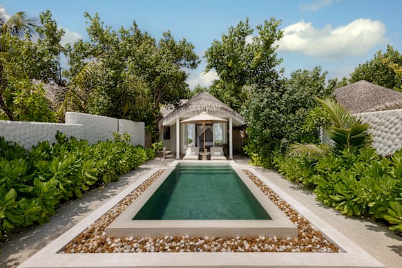 The beach villas at Six Senses Kanuhura are knitted into a palm-tufted, island landscape.
