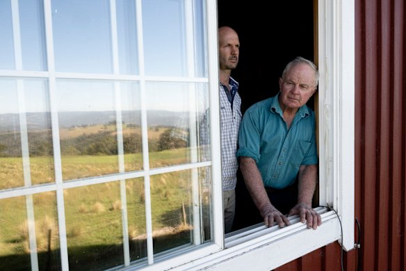 Bruce Moore and his son Nick. The family has lived off the grid for years, but now the grid is coming to them.
