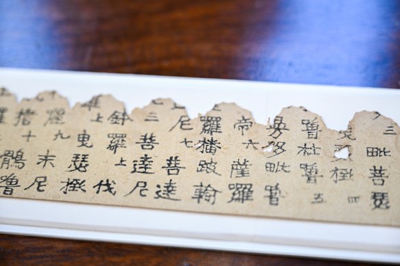 The world’s oldest printed object –  a 1250-year-old print of Buddhist prayers – at the Melbourne Rare Book Fair. 