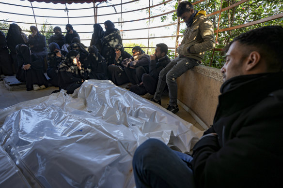 Palestinians react next to the bodies of their relatives who were killed in the Israeli bombardment of the Gaza Strip, at Al-Aqsa Hospital in Deir al-Balah, on Wednesday.