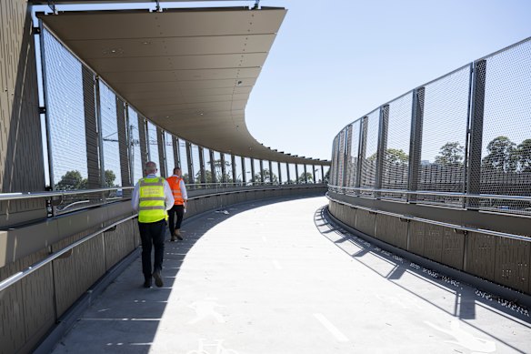 The new Falcon Street bridge for pedestrians and cyclists arcs over the Warringah Freeway.