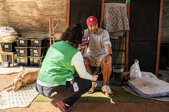 Emma Barnett checks up on homeless patient Gilly and his two dogs.