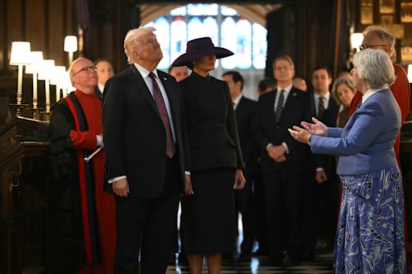 US President Donald Trump, First Lady Melania Trump and US officials tour the quire of St George’s Chapel with Chapter Clerk Charlotte Manley, right.