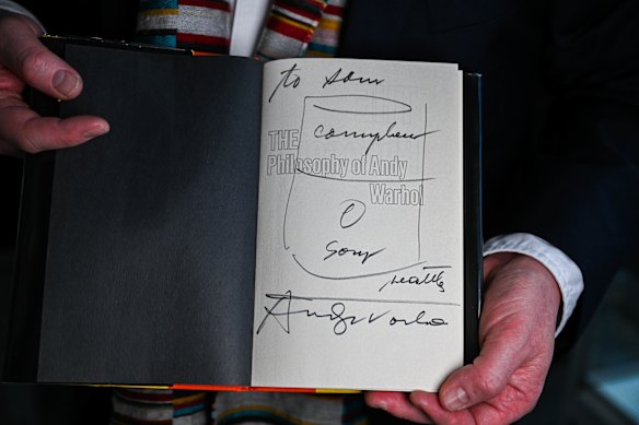 Andy Warhol’s inscription - replete with a Campbell soup can sketch.