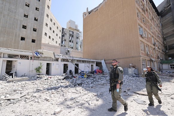 Israeli personnel inspect the scene at the Soroka Medical Centre, which was hit by an Iranian missile.