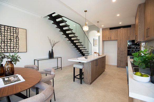  The kitchen features a gold-veined marble island kitchen with a suite of premium appliances, according to the listing.