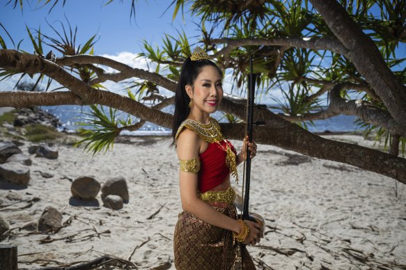 Brisbane-based composer Peranya Visitchantaragoon with a Saw Duang in Brisbane on Friday.