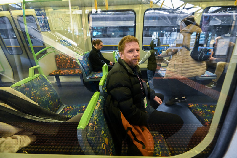 Rick Gned is on the train during his long commute to work.