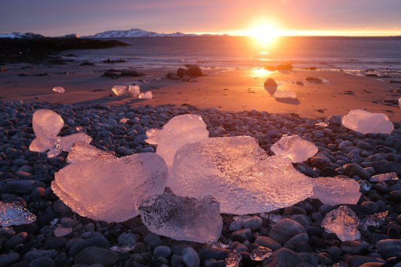 Chunks of ice lie washed up on the shore at sunset on January 21, 2026 in Nuuk, Greenland. European leaders are scheduled to meet later this week to formulate their response to U.S. President Donald Trump’s recent threat of punitive tariffs against countries who obstruct his desire to acquire Greenland. 