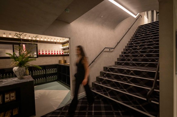The entry into the basement space is meant to evoke a wine cave.