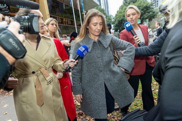Doula Emily Lal (centre) leaves the Victorian Coroners Court on Tuesday. Lal gave evidence at the inquest into the death of Stacey Warnecke, a wellness and nutrition influencer who died from a postpartum haemorrhage after a free birth at her Melbourne home, which Lal attended.