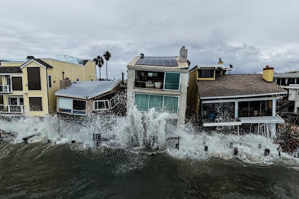 Waves from post-tropical cyclone Rachel crash into beachfront homes in Long Beach, California.