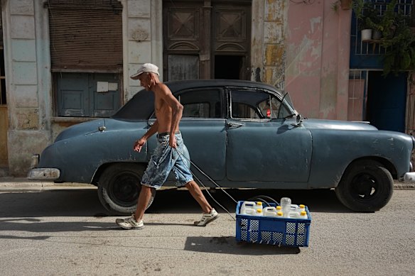 A man pulls a cart carrying drinking water during a power outage in Havana, Cuba, last week.