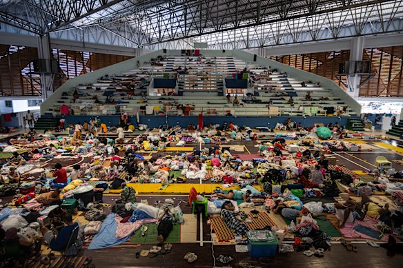 Displaced people at a gymnasium in Hat Yai during the week. It is being used as an evacuation centre where thousands are taking shelter. 