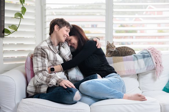 Hobart couple Lauren Watson (left) and Jess Yasuda,  pictured with Yasuda’s cat, Ava, are in a living-apart-together relationship.