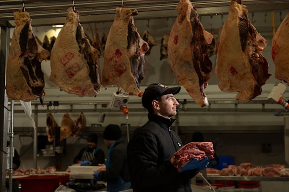 Rob Greenhalgh-Ward with a bolar blade for slow-cooking – something popular with the increasing number of older customers – at the Australian Meat Emporium in Sydney.