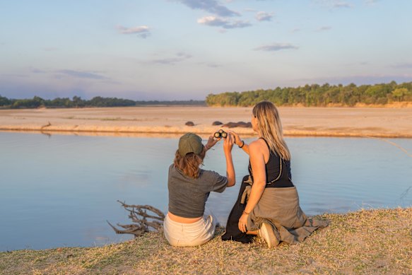 Base camp overlooks a floodplain that attracts hippos and elephants.