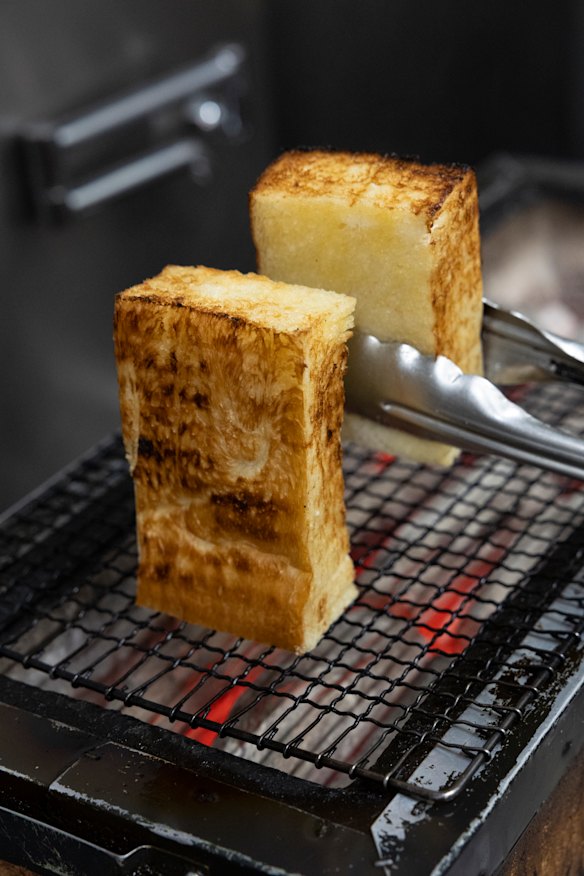 Buttery, fluffy shokupan bread is grilled over binchotan, a clean-burning Japanese charcoal.