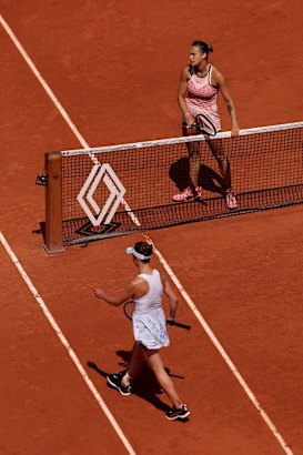 Belarusian Aryna Sabalenka waits at the net as Elina Svitolina of Ukraine refuses to shake hands.
