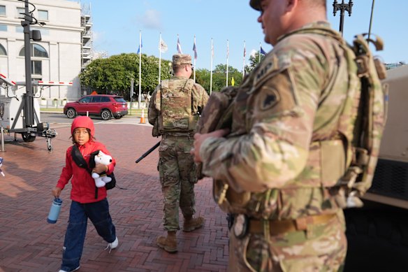 National Guard personnel keep watch at the entrance to Union Station in Washington on Friday.