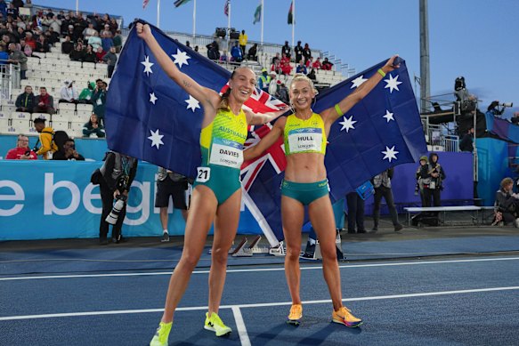 Rose Davies and Jess Hull celebrate after winning gold and silver in the women’s 5000m.