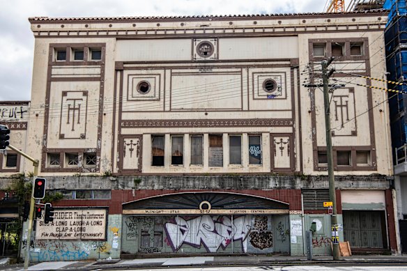 The windows of the former Homebush theatre have been boarded up and its facade vandalised.