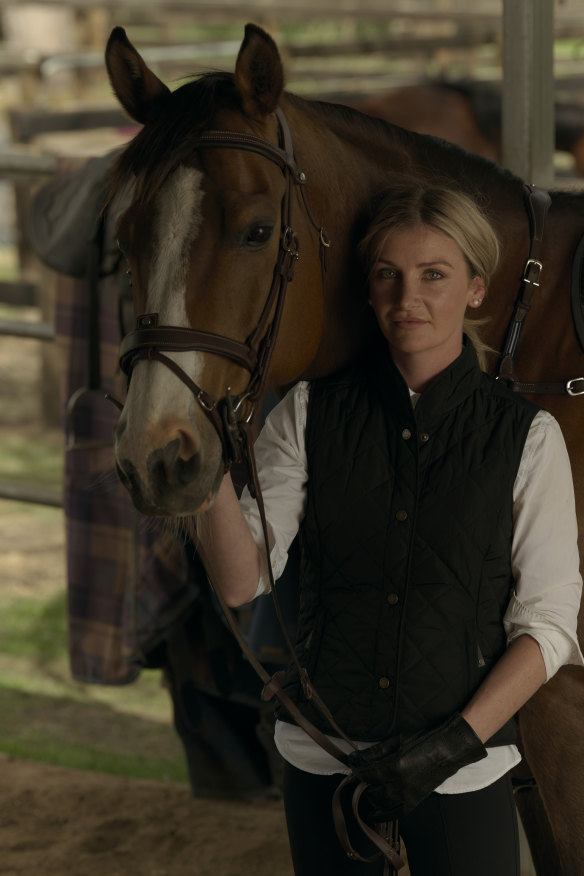 Kah with one of her favourite horses, Dollars, a retired racehorse turned equestrian horse.