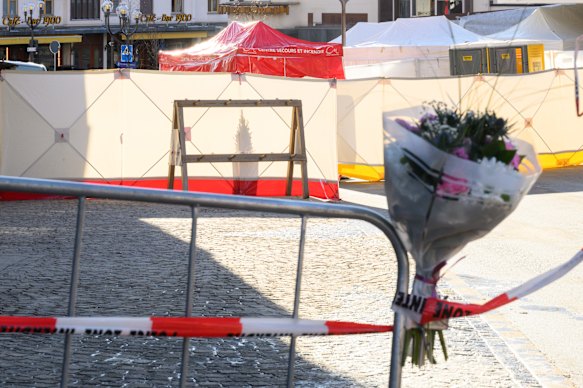 Flowers left on a railing after the fire.