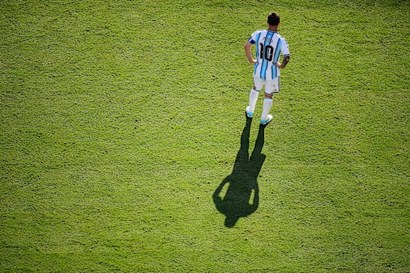 Argentina’s Lionel Messi casts a shadow during the World Cup final soccer match between Spain and Argentina in East Rutherford, New Jersey.