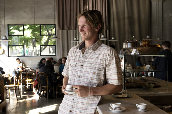 A customer enjoys a $2 espresso at the espresso bar at the Genovese Cafe.