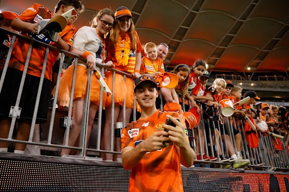 Mahli Beardman celebrates with fans after another victory for the Scorchers.