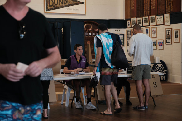 Voters at a polling booth at Bondi Beach.
