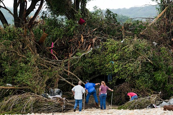 People search through debris in Hunt on Sunday,