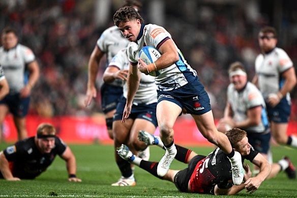Teddy Wilson on his way to the try line for the Waratahs against the Crusaders.