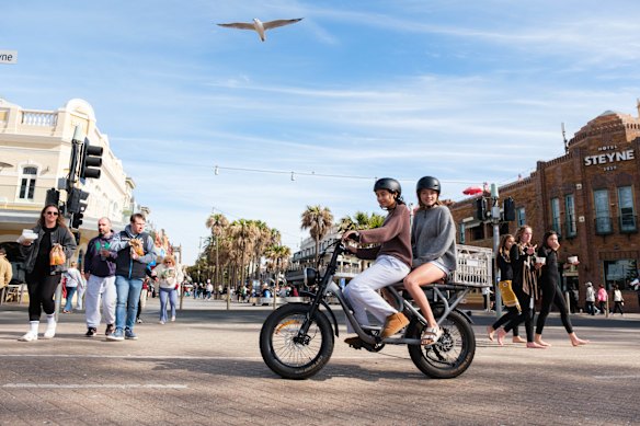 A fat bike being ridden through Manly’s The Corso. 