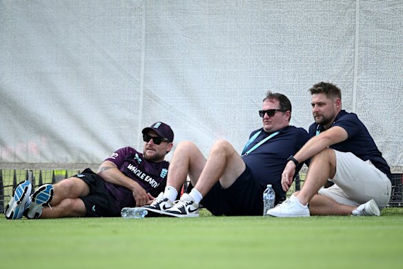 England coach Brendon McCullum (left) runs his eye over a training session on November 20.