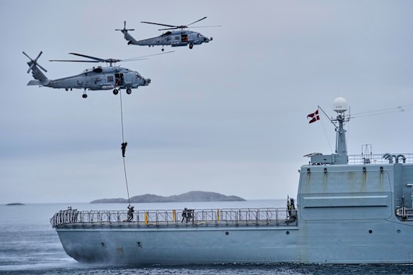 Danish military forces join hundreds of troops from European NATO members to conduct exercises in the Arctic Ocean off the Greenland coast in September.