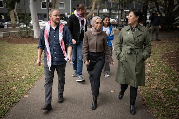 Palestinian Action Group members Josh Lees and Amal Naser with NSW Greens MP Jenny Leong (right).