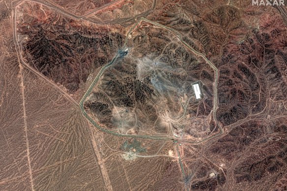 A satellite image provided by Maxar Technologies shows damage at the Fordow enrichment facility after the US strikes.