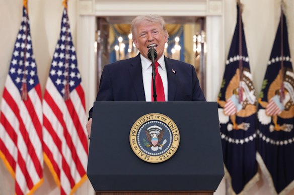 US President Donald Trump speaks about the Iran war from the Cross Hall of the White House.