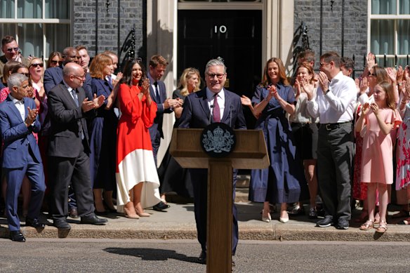 Keir Starmer receives applause as he leaves No. 10 Downing Street.