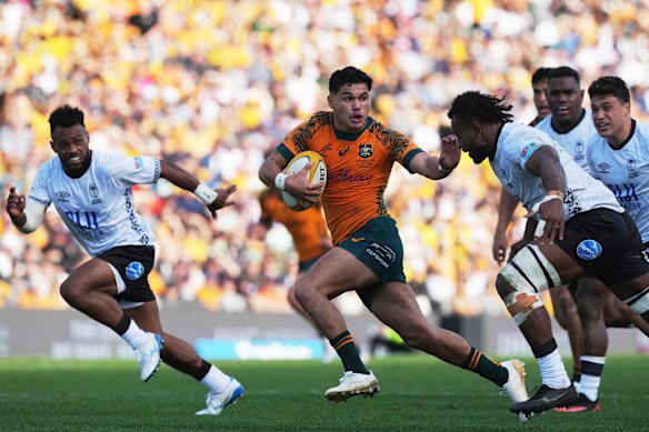 Noah Lolesio makes the break against Fiji, before his injury.